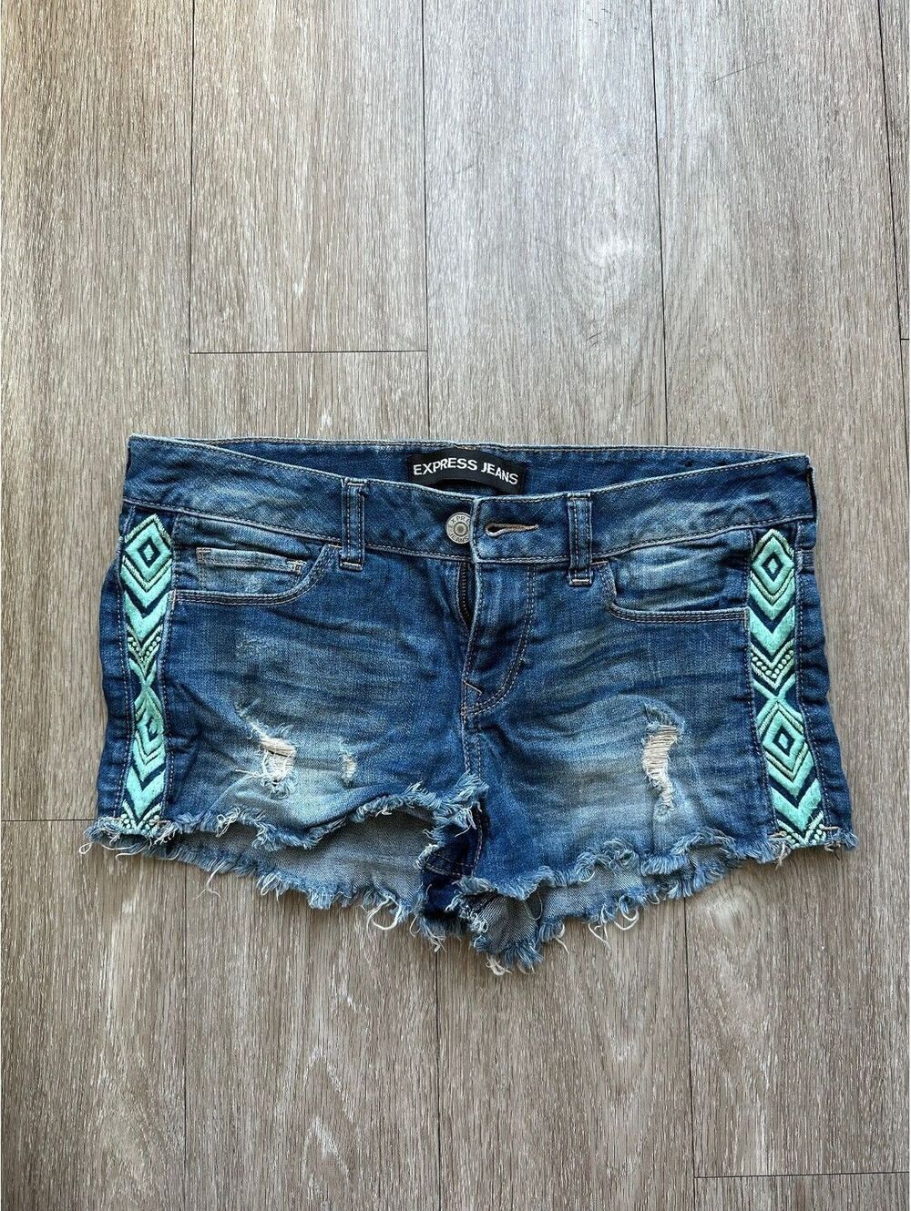 Express Women's low rise dark wash demin shorts w/ teal embellishment